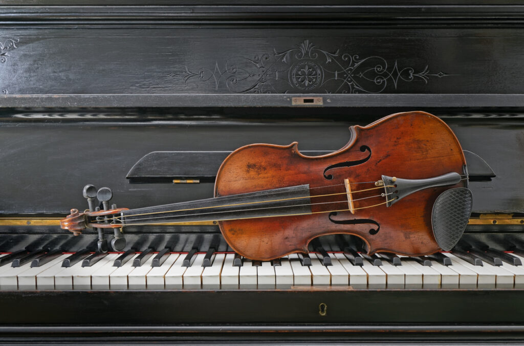 close up Antique Violin and piano instruments